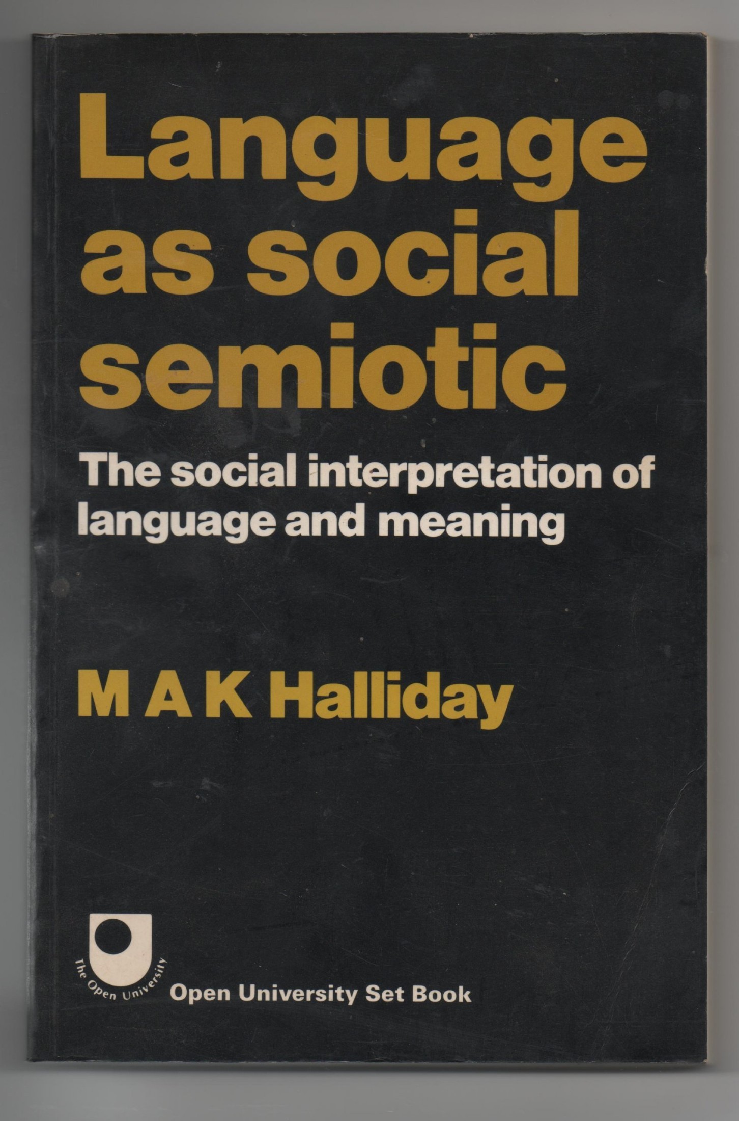 Language as Social Semiotic: The Social Interpretation of Language and Meaning